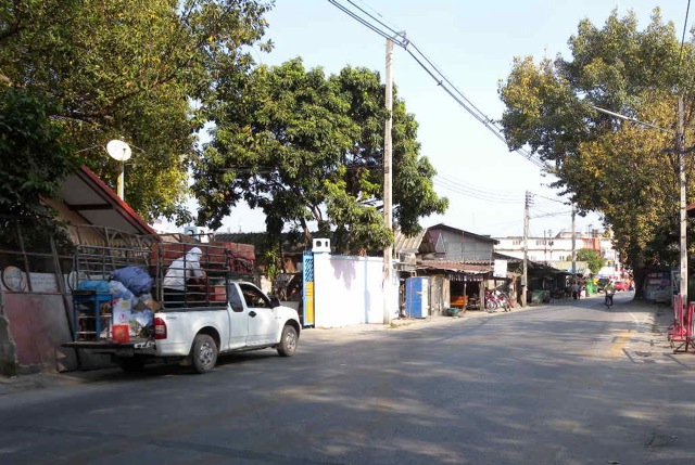 A quiet street in daytime, but buzzing with scooters and girls in the night